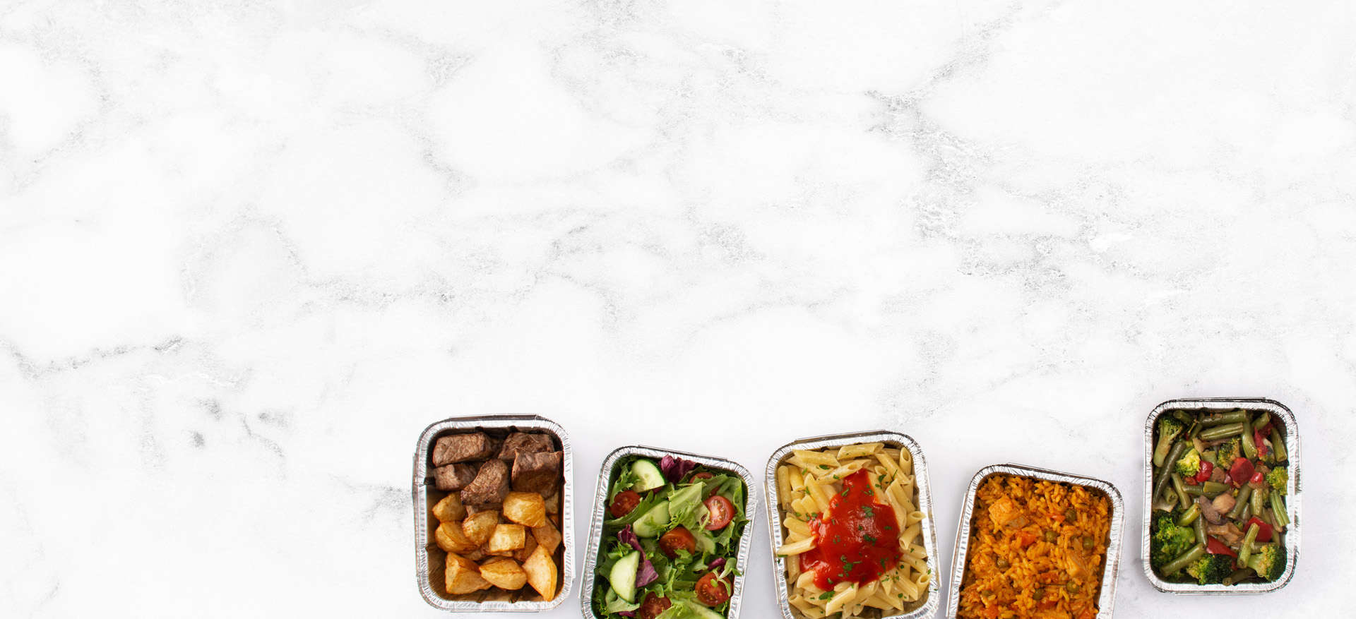 packaged meals on marble counter